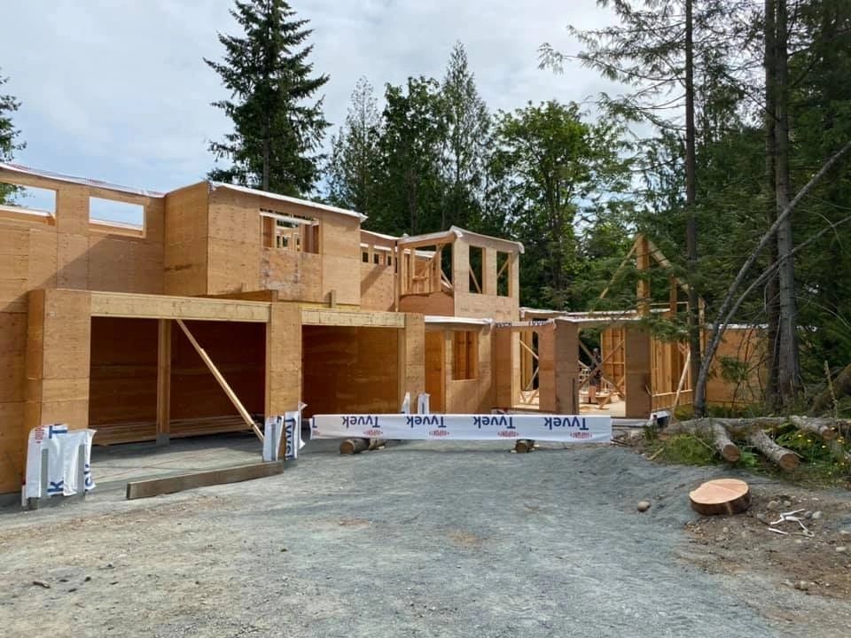 Home under construction forest framing
